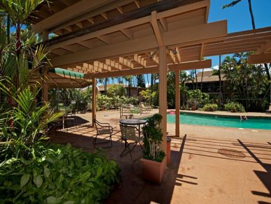 Outdoor dining area by the pool Outdoor dining area by the pool